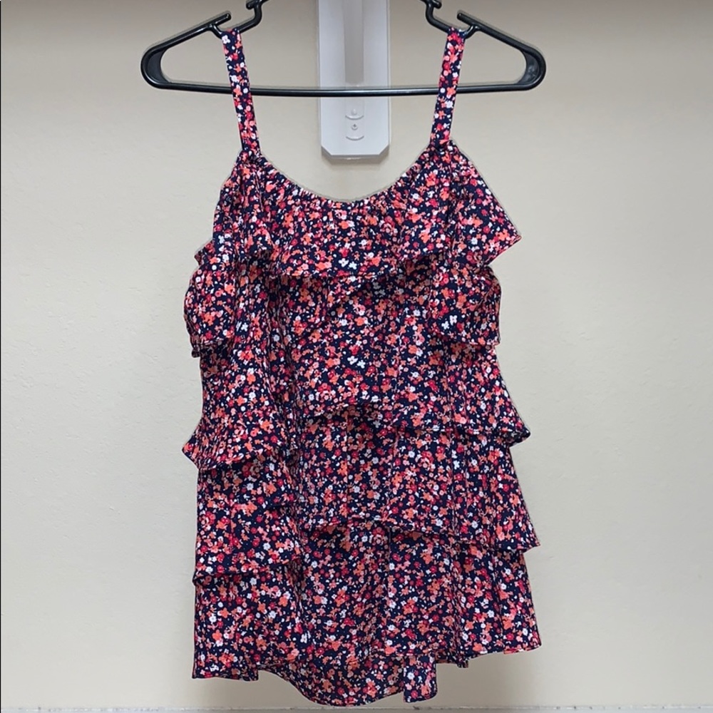 Cute floral top with straps and sleeves.